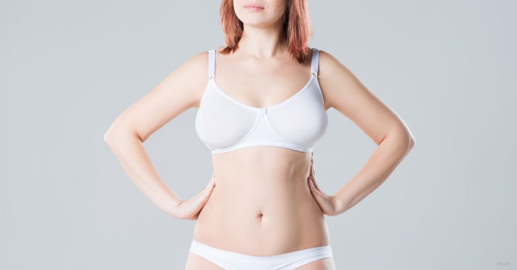 Model image of a woman in white lingerie with her hands on her hips (MODEL)