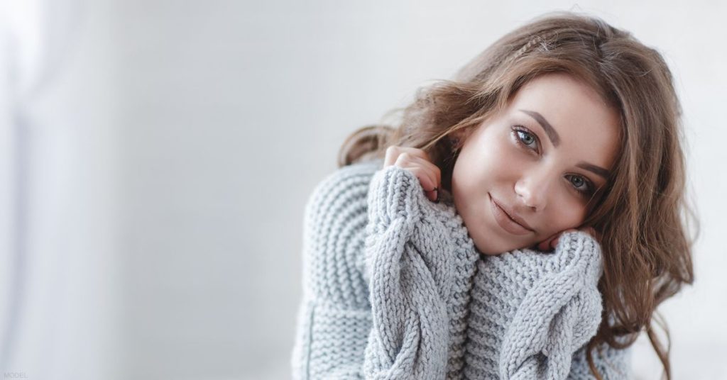 Beautiful woman wearing a sweater (model)